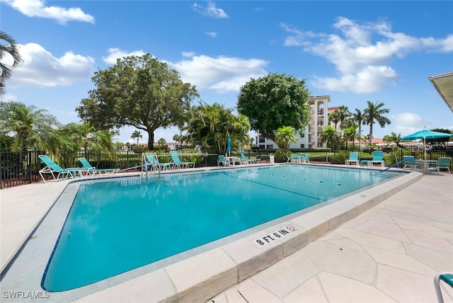 view of swimming pool featuring a patio