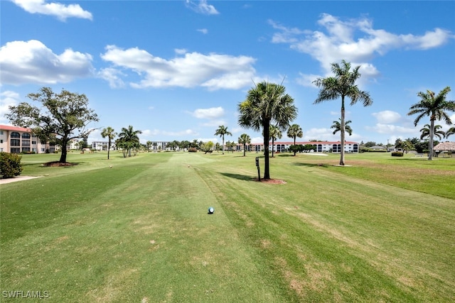 view of home's community featuring a lawn