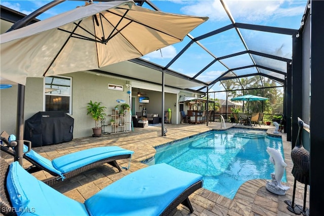 view of pool featuring a grill, a lanai, and a patio