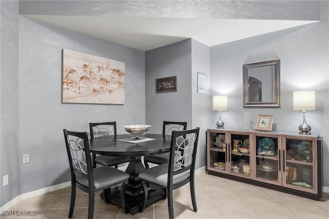 dining space with light tile patterned floors