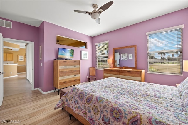 bedroom featuring ceiling fan and light wood-type flooring