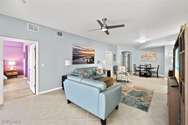 living room with ceiling fan and light tile patterned floors