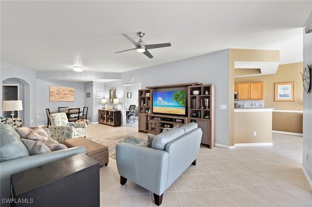 tiled living room featuring ceiling fan