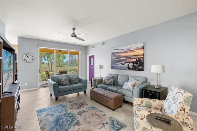 tiled living room featuring ceiling fan