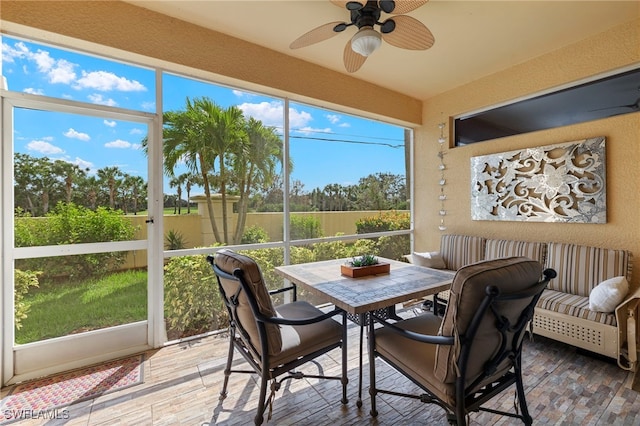 sunroom / solarium with ceiling fan