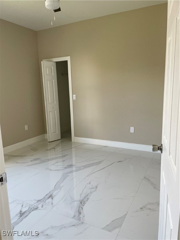 unfurnished bedroom featuring ceiling fan