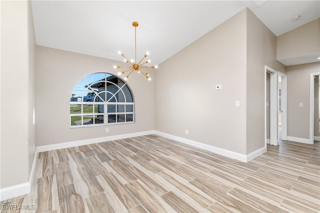 unfurnished dining area featuring a notable chandelier, high vaulted ceiling, and light hardwood / wood-style floors