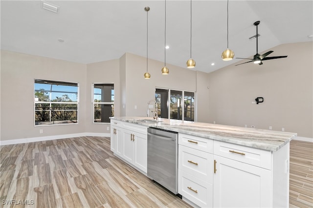 kitchen featuring light stone countertops, sink, dishwasher, pendant lighting, and white cabinets