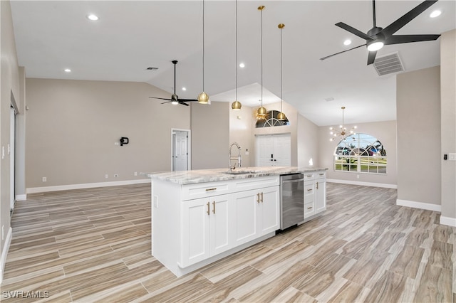 kitchen featuring a center island with sink, pendant lighting, white cabinets, light stone counters, and light hardwood / wood-style floors