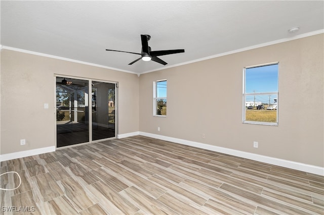 empty room featuring light hardwood / wood-style floors, crown molding, and ceiling fan