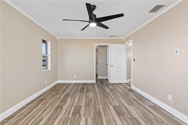 empty room with light hardwood / wood-style flooring, ceiling fan, and crown molding