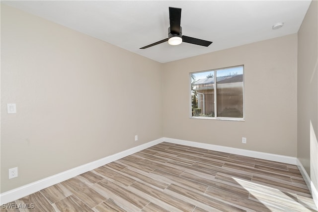 spare room with light hardwood / wood-style floors and ceiling fan