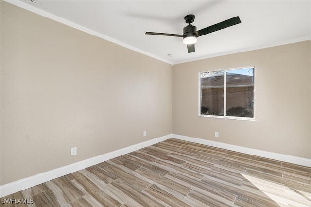 spare room with light hardwood / wood-style floors, ornamental molding, and ceiling fan