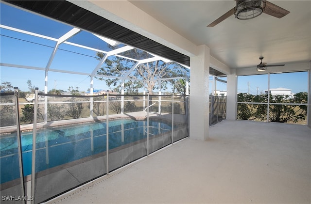 view of pool featuring a patio, a lanai, and ceiling fan