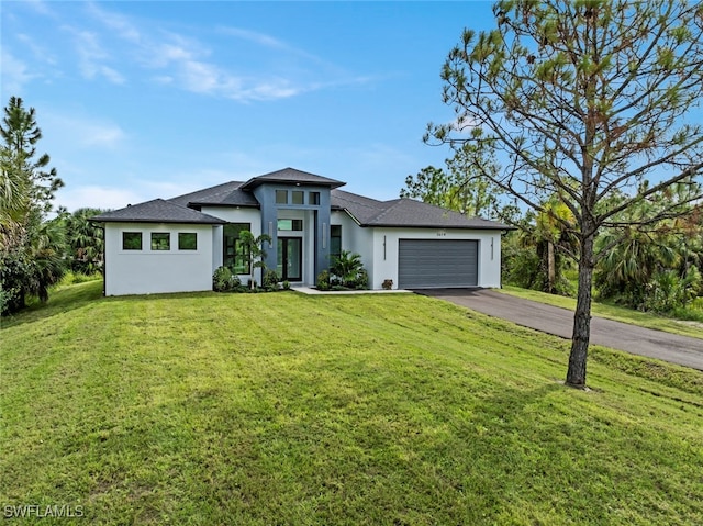 prairie-style house with a front yard and a garage