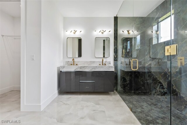 bathroom with vanity and a shower with door