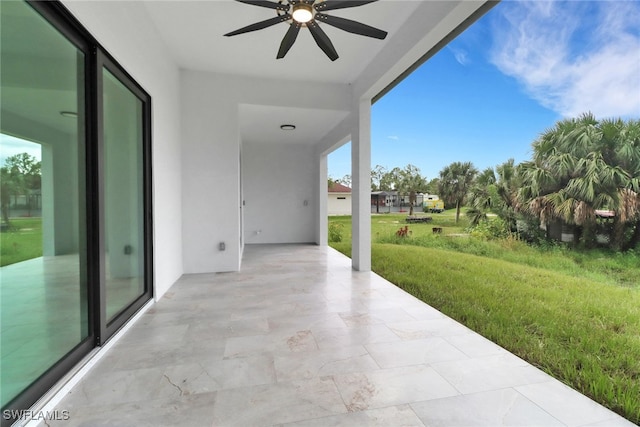 view of patio featuring ceiling fan