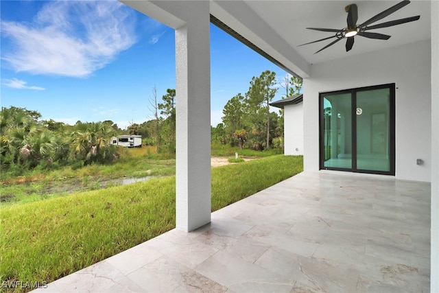 view of patio / terrace featuring ceiling fan