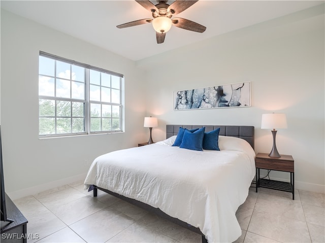 bedroom featuring light tile patterned flooring and ceiling fan