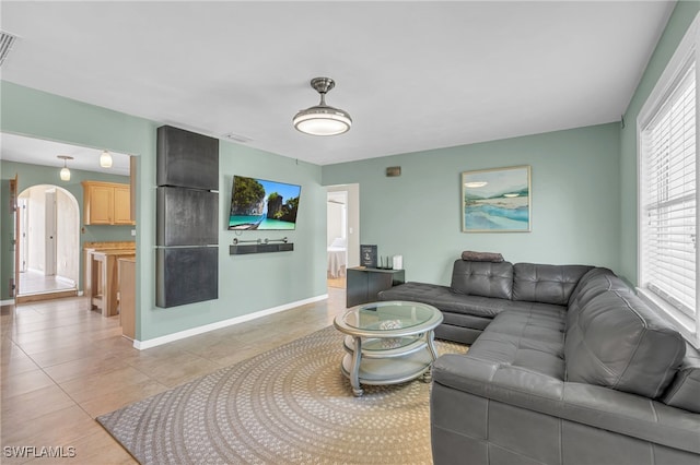 living room with light tile patterned floors