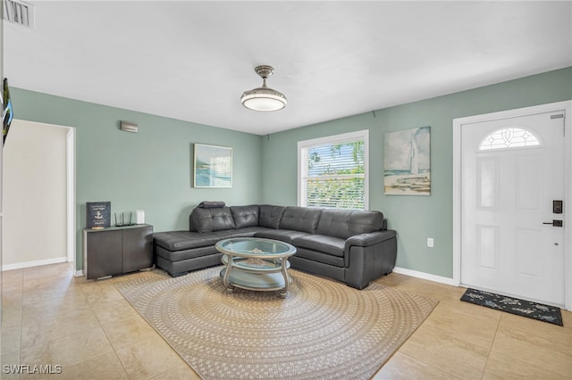 living room with light tile patterned flooring