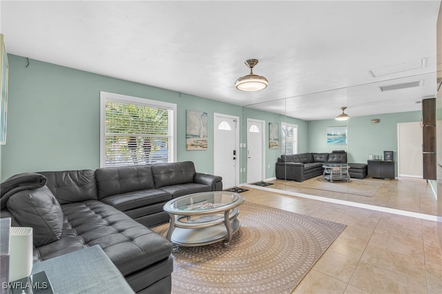 living room with light tile patterned flooring