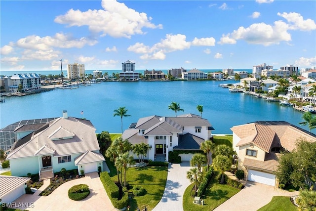 birds eye view of property with a water view