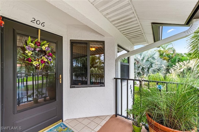 doorway to property with stucco siding
