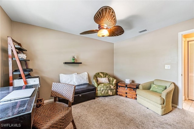 sitting room featuring carpet, ceiling fan, and baseboards
