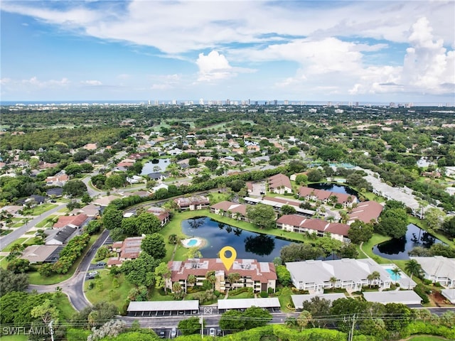 drone / aerial view with a residential view and a water view