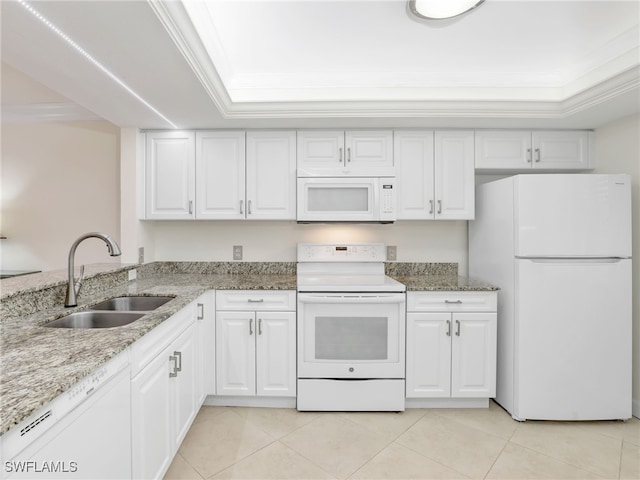 kitchen featuring ornamental molding, a sink, white appliances, white cabinets, and light stone countertops