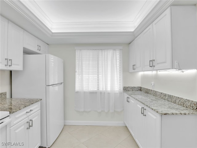 kitchen featuring white cabinetry, light tile patterned floors, light stone countertops, and ornamental molding