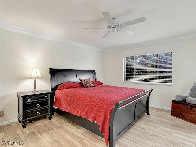 bedroom with ceiling fan, crown molding, baseboards, and wood finished floors