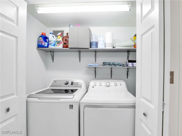 laundry area featuring laundry area and separate washer and dryer