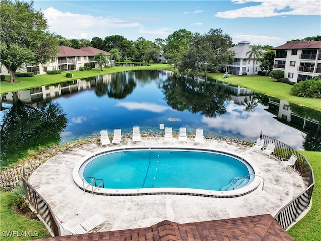 view of pool with a water view