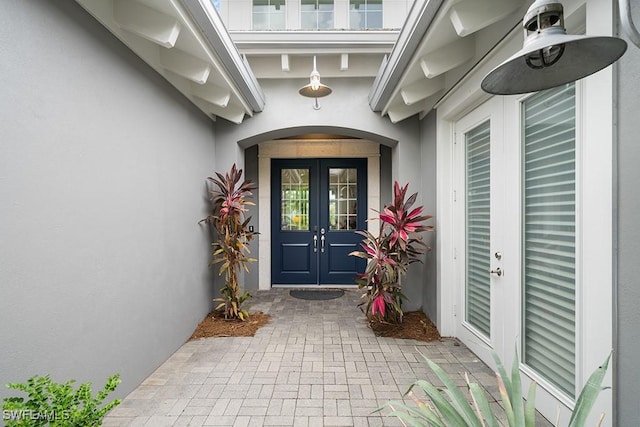 5154 Andros Dr, Naples, FL 34113 - property entrance with french doors and stucco siding