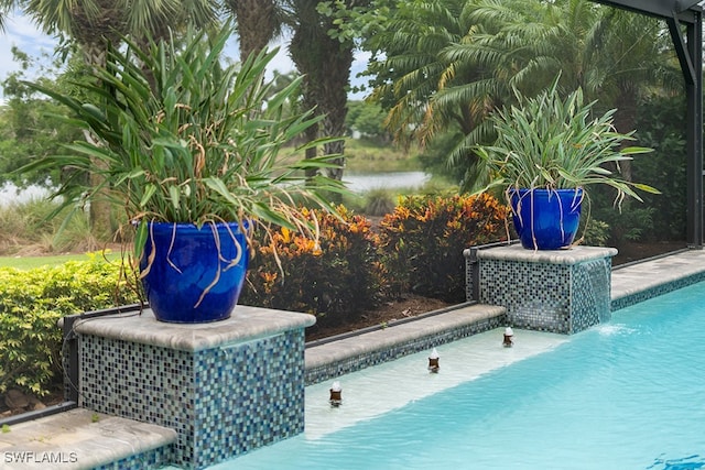 view of pool featuring pool water feature