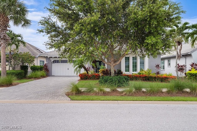 obstructed view of property featuring a garage