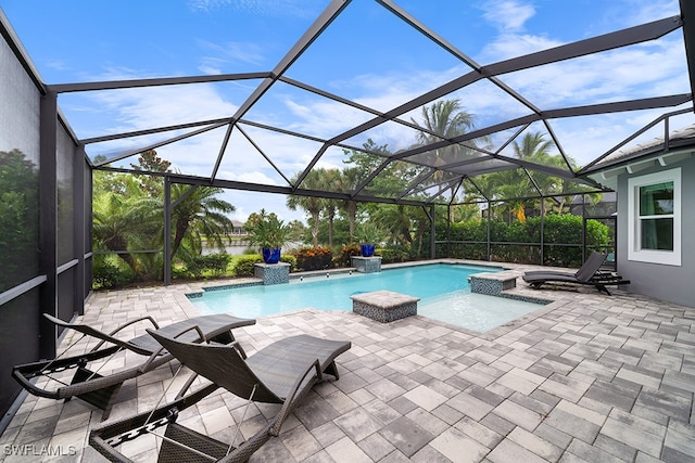 view of swimming pool featuring a patio, a jacuzzi, a lanai, and pool water feature