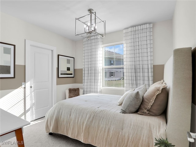 bedroom with an inviting chandelier