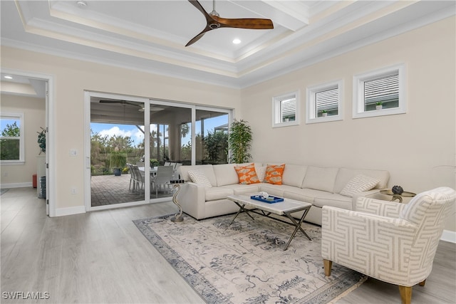 living room with ceiling fan, ornamental molding, hardwood / wood-style floors, and a healthy amount of sunlight