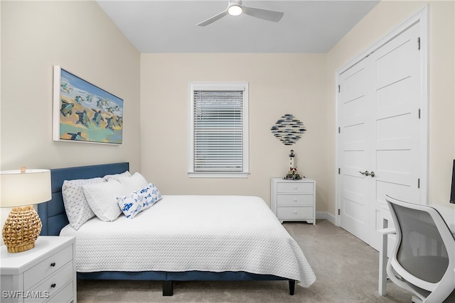 bedroom with light carpet and ceiling fan