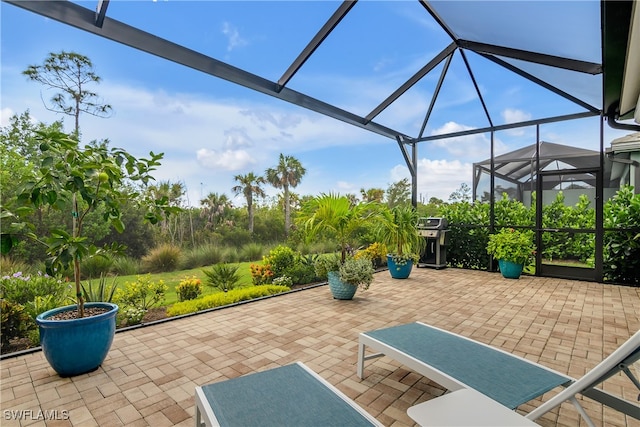 view of patio / terrace with a lanai