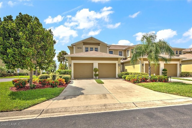 view of front facade featuring a garage and a front lawn