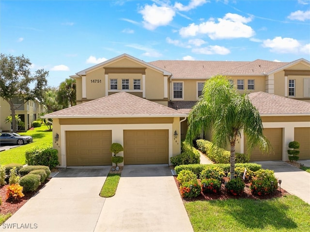 view of front facade featuring a front lawn and a garage