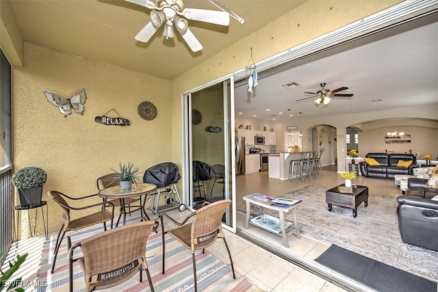 view of patio / terrace featuring ceiling fan