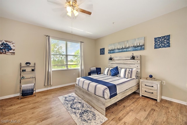 bedroom with ceiling fan and light hardwood / wood-style floors