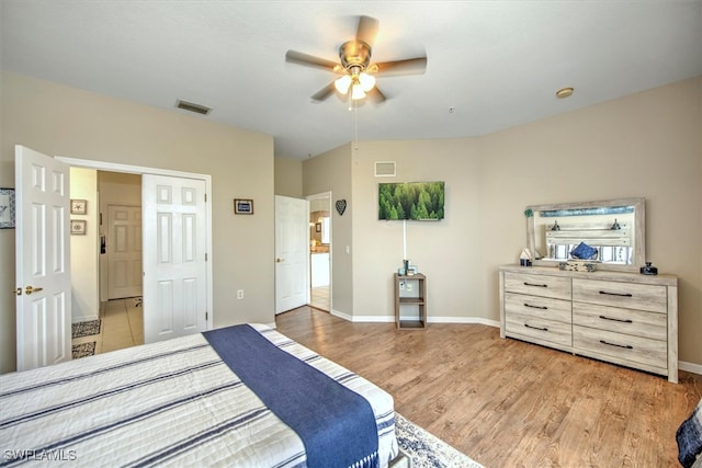 bedroom featuring ceiling fan and light hardwood / wood-style flooring