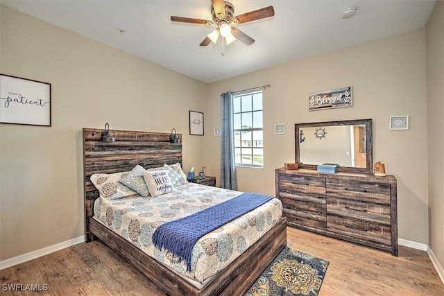 bedroom featuring ceiling fan and hardwood / wood-style floors