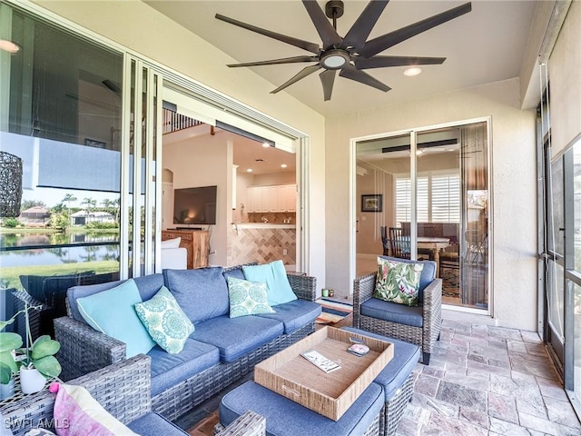 sunroom with ceiling fan